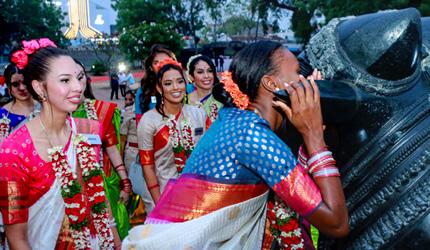 What Is She Whispering Into Nandi's Ear?