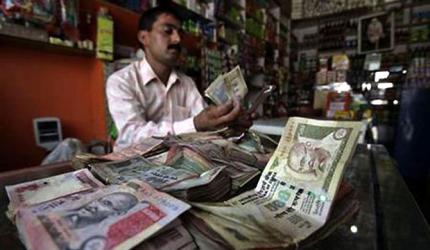 Rupee Slumps to Record Low: USD Impact