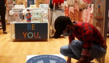 COVID fallout: Markets crowded, but malls empty