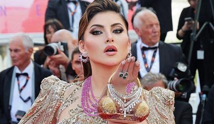 Urvashi Flaunts Bikini Shaped Clutch