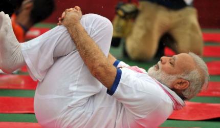 PHOTOS: Even the rains can't stop Modi from doing yoga