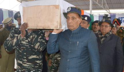 PIX: Rajnath helps carry coffin of slain CRPF jawan