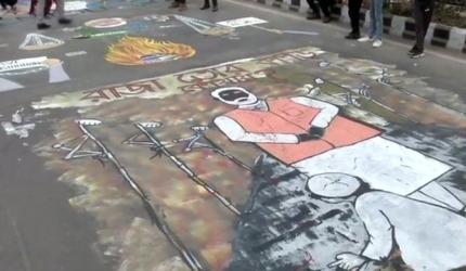 PIX: Jamia students paint road with anti-CAA graffiti