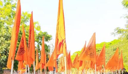 Row erupts over Udupi commissioner holding saffron flag