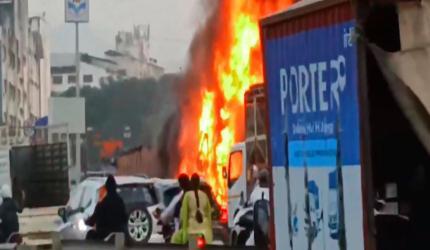 Pune: 8 killed as car crushed between trucks catches fire