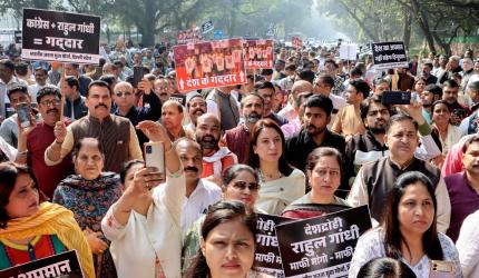 Shirtless stir: Cong faces backlash; Rahul shown black flags