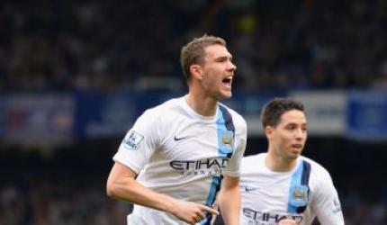 Man City back on top after Dzeko double downs Everton