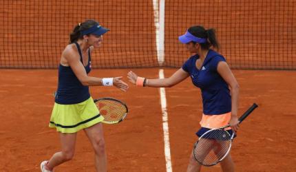 Sania-Martina pair storms into quarters; Paes, Bopanna ousted