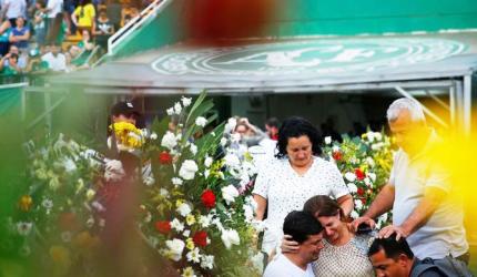 Grieving Brazilian town receives bodies of soccer crash victims