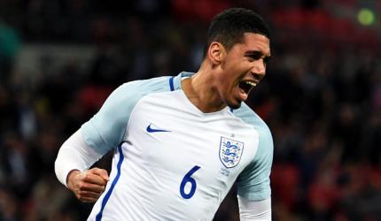 PHOTOS: Smalling smiling after England sink Portugal