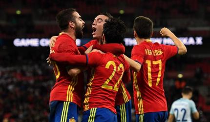 PHOTOS: Spain rally to hold England; Italy vs Germany goalless