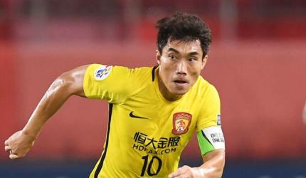 Zhi gets four-game ban for handshake snub