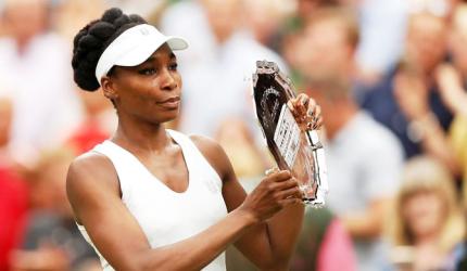 Error-prone Venus heaps praise on Muguruza after Wimbledon heartbreak