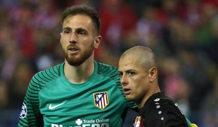 Atletico march into quarters as Oblak shines