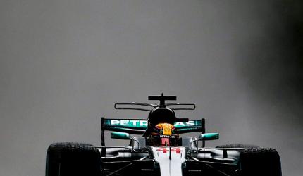Hamilton beats rain to break Schumacher's pole record