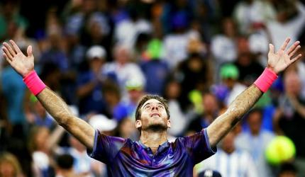 US Open PIX: Ailing Del Potro survives, Federer eases through