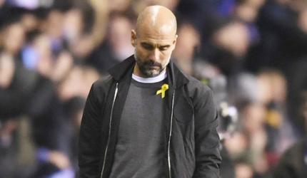 FA charges Guardiola for wearing Catalan support ribbon