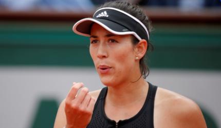 Muguruza has her 'game face' on, smiles can wait