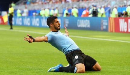 FIFA WC PIX: Uruguay thrash 10-man Russia 3-0 to lead Group A