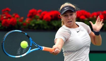 American teen Anisimova stuns Wang, Tomic crashes out