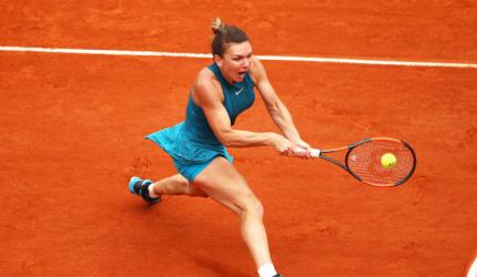 French Open PIX: Halep rallies to advance; Djokovic, Kvitova through