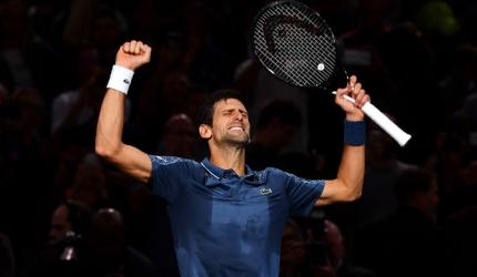 Djokovic outlasts Federer to set up Khachanov final