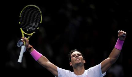 Nadal battles from brink to beat Medvedev
