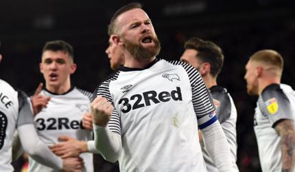 Football round-up: Rooney on target in 500th game