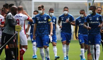 Brazilian team wear masks in protest at having to play