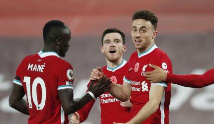 PICS: Liverpool go top after close win over West Ham