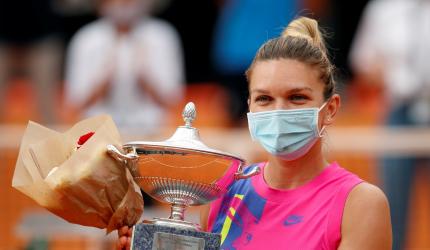 Halep claims Rome title after Pliskova retires 