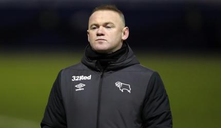 Rooney ends playing career to become Derby manager