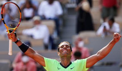 PIX: Nadal overcomes tough test to reach semis