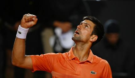 Djokovic keeps top spot after beating Auger-Aliassime