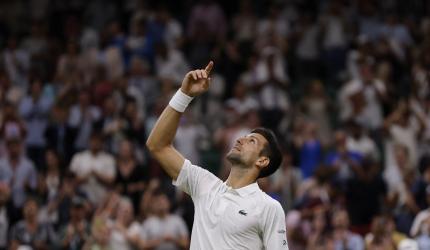 Djokovic survives Wawrinka's late surge