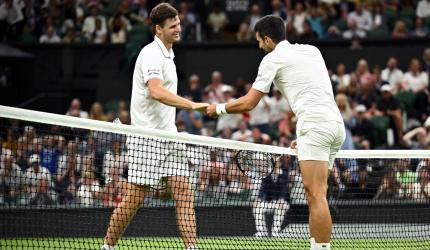 Wimbledon: Djokovic in charge before play suspended