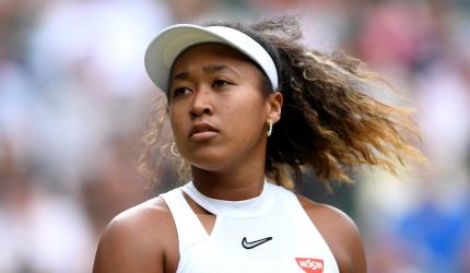 Osaka earns first grass win of the season