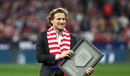 World Cup star Forlan takes up tennis racket