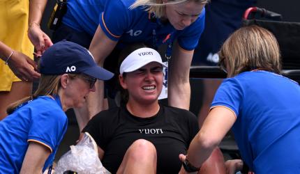 Heat, cramps, tears rock Australian Open Day 2