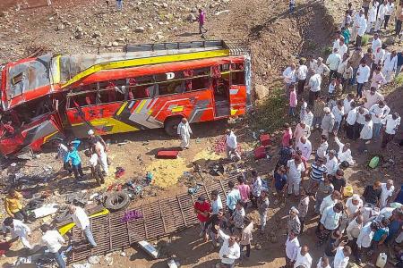 13 passengers charred to death in bus-dumper collision in MP - Rediff.com