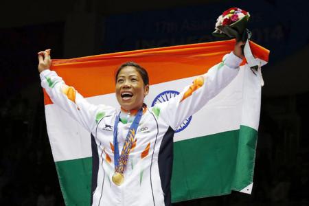 Asian Boxing: Pooja strikes gold; Mary signs off with silver - Rediff.com