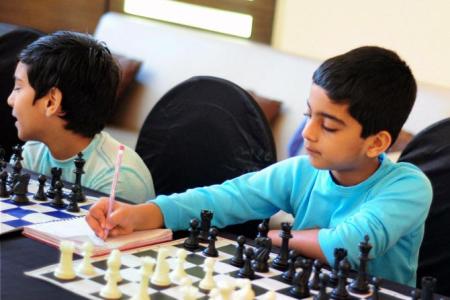 PIX: Vishy Anand celebrates International Chess Day with son - Rediff.com