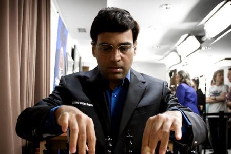 PIX: Vishy Anand celebrates International Chess Day with son - Rediff.com