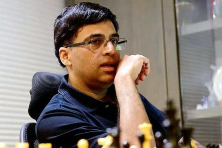 PIX: Vishy Anand celebrates International Chess Day with son - Rediff.com