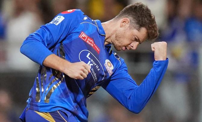 IPL PIX: Santner, SKY power MI into play-offs