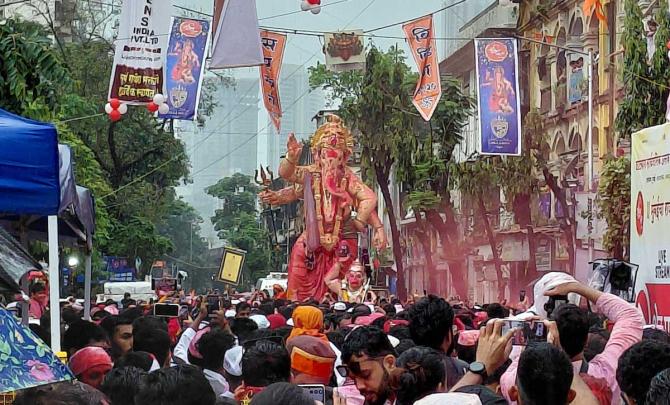 Mumbai bids farewell to Bappa amid rain, bomb threat