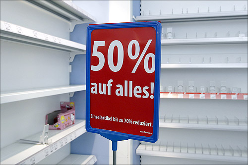 Empty shelves are pictured during the last day of the closing down sale at a Schlecker drugstore in Munich.