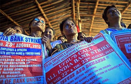 Bank employees hold placards at a rally during a two-day strike in Mumbai.