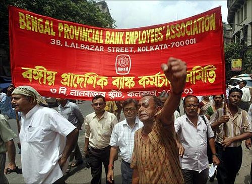 A bank employee shouts slogans while taking part in a rally during a two-day strike in Kolkata.