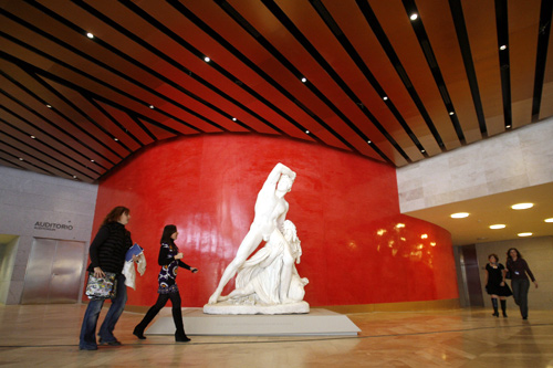 Visitors walk through the Prado Museum's new extension during a media presentation.